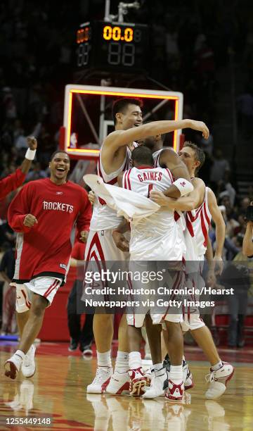 The Houston Rockets surround Tracy McGrady after he hit the game winning shot to help the Rockets defeat the San Antonio Spurs 81-80 in Thursday's...