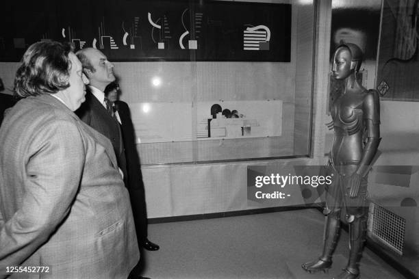 Photo taken on March 22, 1975 shows director of the Cinémathèque Française Henri Langlois and French Secretary of State for Culture Michel Guy...