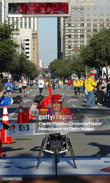 Saul Mendoza crosses the finish line of the HP Houston Marathon to win the men's full marathon wheelchair division in Houston, Texas January 16,2005....