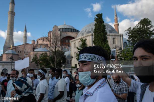 People gather for evening prayers outside Istanbul's famous Hagia Sophia on July 10, 2020 in Istanbul, Turkey. Turkey's top administrative court...
