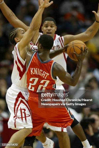 The Houston Rockets Tyronn Lue and Maurice Taylor double team the Charlotte Bobcats Brevin Knight during the third quarter of Wednesday's NBA game at...