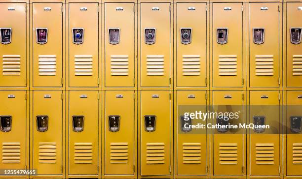 row of traditional metal school lockers - education stock pictures, royalty-free photos & images