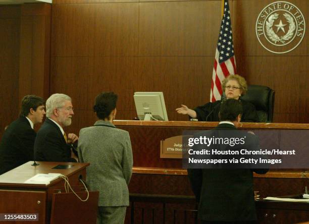 Clara Harris the Friendswood dentist who ran over and killed her husband with a Mercedes Benz pleads not guilty with her attorney George Parnham at...