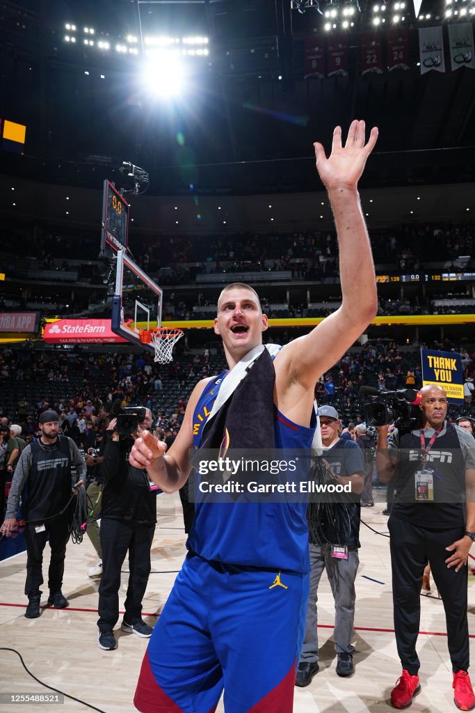 Nikola Jokic of the Denver Nuggets waves to his family after Round 3