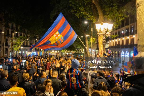Barcelona fans are celebrating at the iconic Canaletes Fountain on Las Ramblas after the Football Club Barcelona won La Liga, following a four-season...