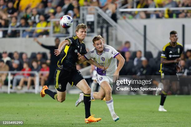 Columbus Crew defender Philip Quinton tries to keep the ball from Orlando City forward Duncan McGuire during the second half in a game on May 13 at...