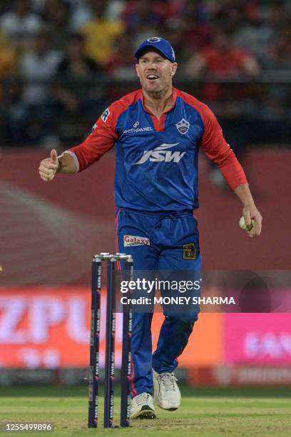 Delhi Capitals' David Warner gestures during the Indian Premier League Twenty20 cricket match between Punjab Kings and Delhi Capitals at the Himachal...