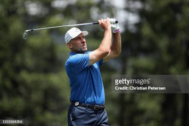 Former MLB athlete John Smoltz plays a tee shot on the fifth hole during round one of the American Century Championship at Edgewood Tahoe South golf...