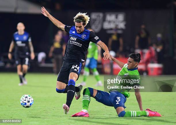 Cade Cowell of San Jose Earthquakes controls the ball past a tackle by Xavier Arreaga of Seattle Sounders during the second half of their game at...