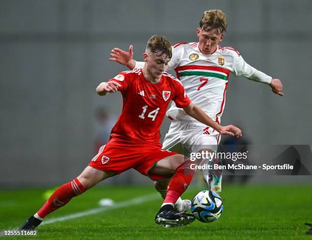 Joshua Beecher of Wales in action against Zétény Varga of Hungary during the UEFA European Under-17 Championship Finals 2023 Group A match between...