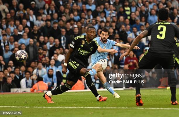 Manchester City's Portuguese midfielder Bernardo Silva scores the opening goal during the UEFA Champions League second leg semi-final football match...