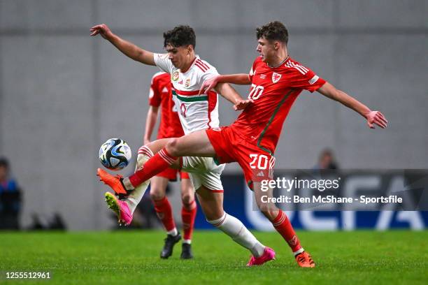 Ádám Bagi of Hungary in action against Troy Perrett of Wales during the UEFA European Under-17 Championship Finals 2023 Group A match between Hungary...