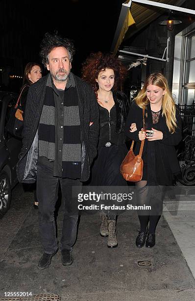 Tim Burton and Helena Bonham Carter with Rose Bonham Carter attend the launch party of Lulu Guinness and Rob Ryan's Fan Bag at Air Gallery on...