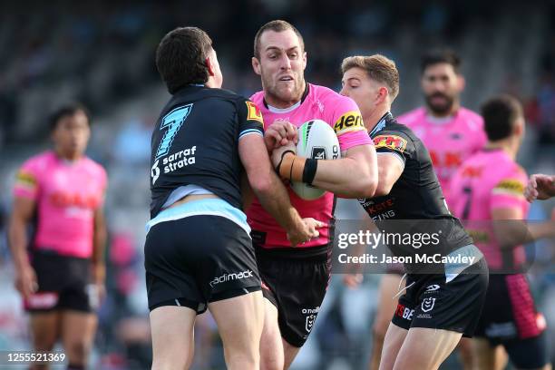 Issah Yeo of the Panthers is tackled during the round nine NRL match between the Cronulla Sharks and the Penrith Panthers at Netstrata Jubilee...