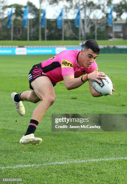 Charles Staines of the Panthers scores a try during the round nine NRL match between the Cronulla Sharks and the Penrith Panthers at Netstrata...