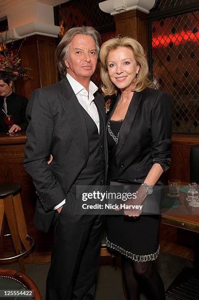 Richard Caring and Jackie Caring attend the 20th anniversary of the famous restaurant at The Ivy on November 8, 2010 in London, England.
