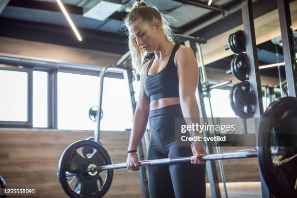 training in the gym - women's weightlifting stock pictures, royalty-free photos & images