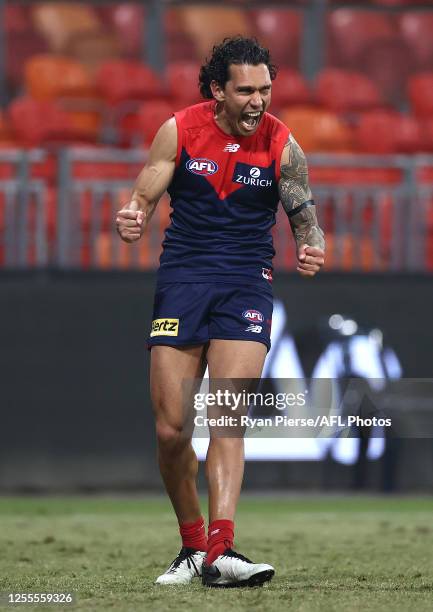 Harley Bennell of the Demons celebrates a goal after the final siren during the round 6 AFL match between the Melbourne Demons and the Gold Coast...