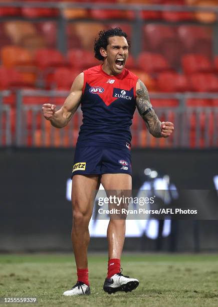 Harley Bennell of the Demons celebrates a goal after the final siren during the round 6 AFL match between the Melbourne Demons and the Gold Coast...