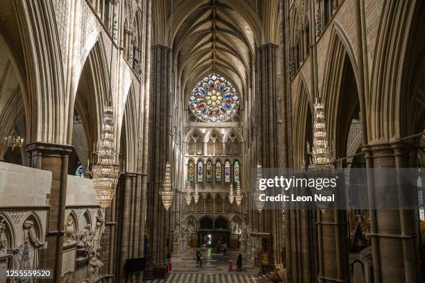 The first visitors to pass through the doors at Westminster Abbey are seen as it re-opens to the public, on July 11, 2020 in London, England....