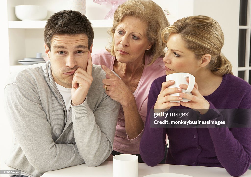 Older woman in between young woman and young man