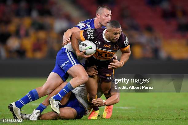 Jamil Hopoate of the Broncos is tacked during the round nine NRL match between the Brisbane Broncos and the Canterbury Bulldogs at Suncorp Stadium on...