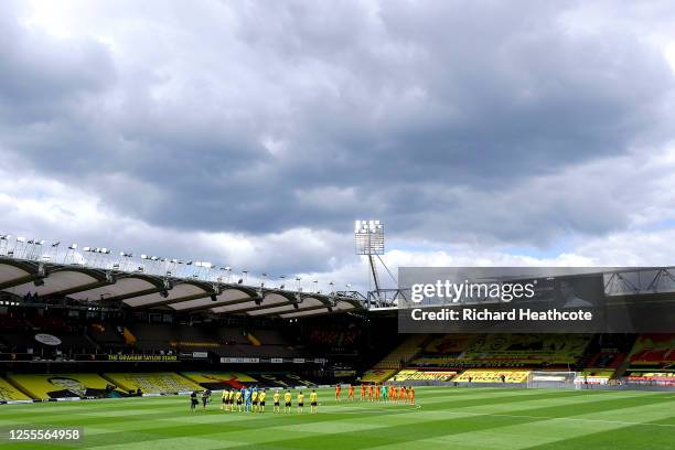 Players and officials take part in a minute of silence to pay tribute to Jack Charlton prior to the Premier League match between Norwich City and...