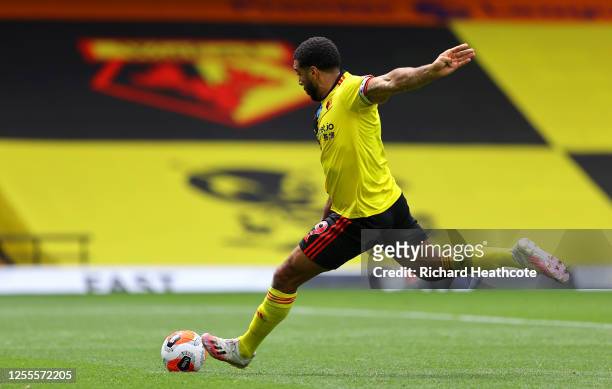 Troy Deeney of Watford scores his team's first goal from a penalty during the Premier League match between Watford FC and Newcastle United at...