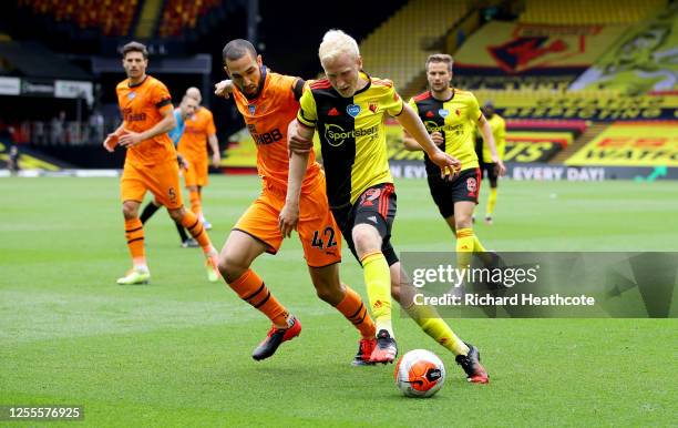 Nabil Bentaleb of Newcastle United and Will Hughes of Watford battle for the ball during the Premier League match between Watford FC and Newcastle...