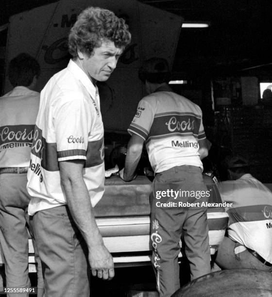 Driver Bill Elliott helps work on his race car in the speedway garage prior to the start of the 1986 Daytona 500 stock car race at Daytona...