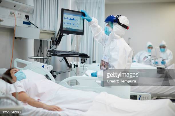 One nurse looking at the medical ventilator screen.
