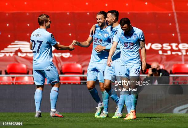 Jay Rodriguez of Burnley celebrates with teammates after scoring his team's first goal during the Premier League match between Liverpool FC and...