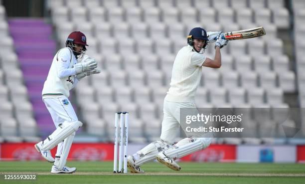 Zak Crawley of England bats watched by West Indies wicketkeeper Shane Dowrich during day four of the 1st #RaiseTheBat Test match at The Ageas Bowl on...