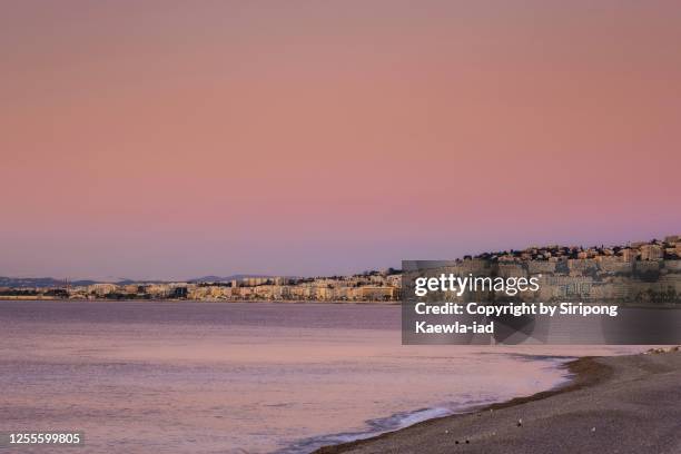 beach coast and the nice city with the romantic sky, provence-alpes-côte d'azur, france. - nice côte dazur airport foto e immagini stock