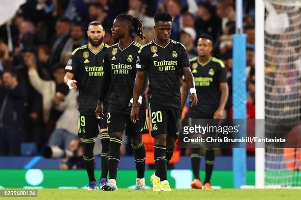 Vinicius Junior of Real Madrid & his team-mates look dejected during the UEFA Champions League semi-final second leg match between Manchester City FC...