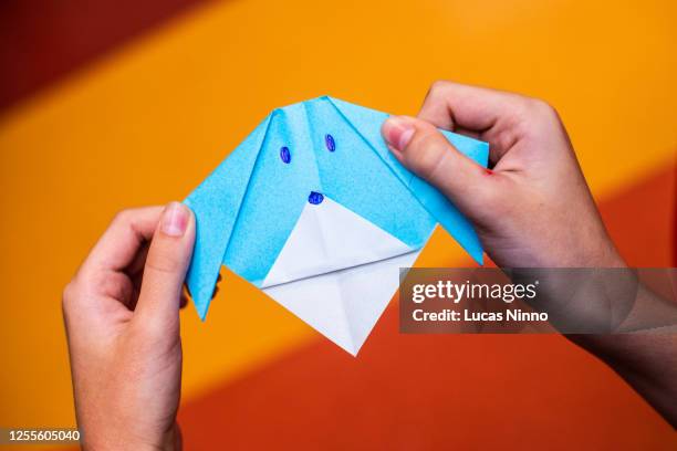 folding paper art - folding origami stock pictures, royalty-free photos & images