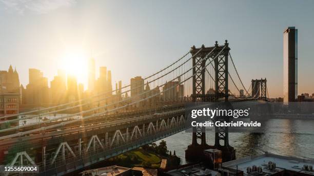 aerial view of road and bridges - manhattan bridge stock pictures, royalty-free photos & images