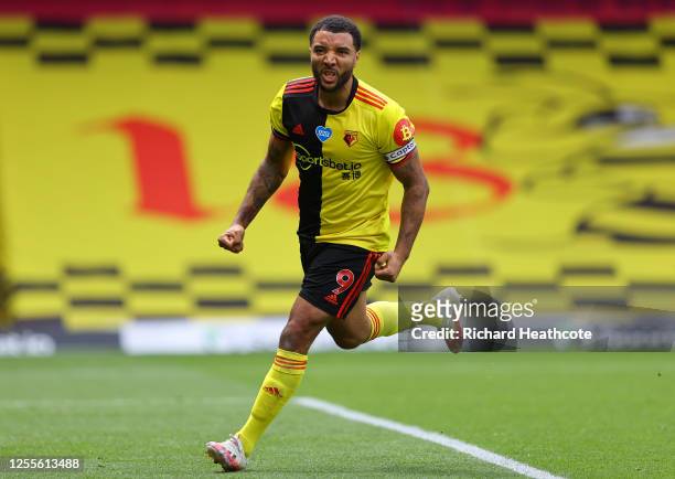 Troy Deeney of Watford celebrates after scoring his team's first goal from a penalty during the Premier League match between Watford FC and Newcastle...