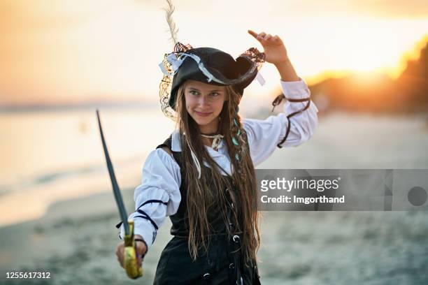 cute pirate girl holding a sabre - period costume stock pictures, royalty-free photos & images