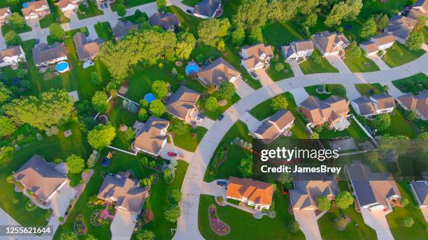 curved street runs through idyllic summer neighborhood, early morning. - house panoramic stock pictures, royalty-free photos & images