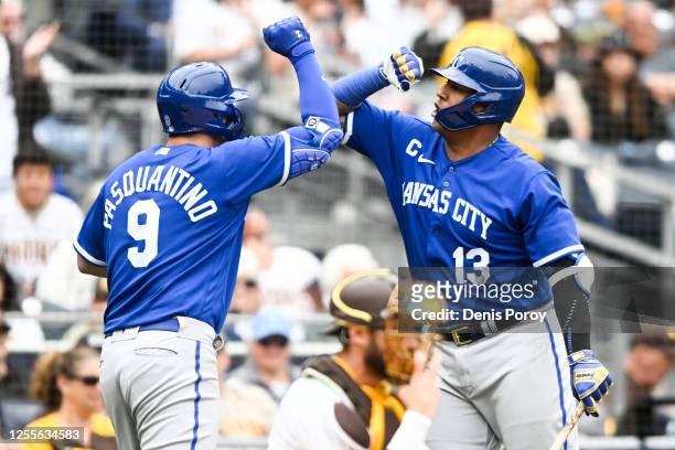 Vinnie Pasquantino of the Kansas City Royals is congratulated by Salvador Perez after he hit a two-run home run during the sixth inning of a baseball...