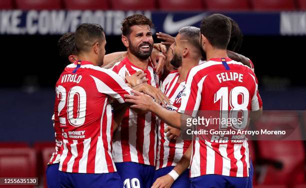Diego Costa of Atletico Madrid celebrates with Yannick Carrasco, Vitolo and Felipe of Atletico Madrid after scoring his team's first goal during the...
