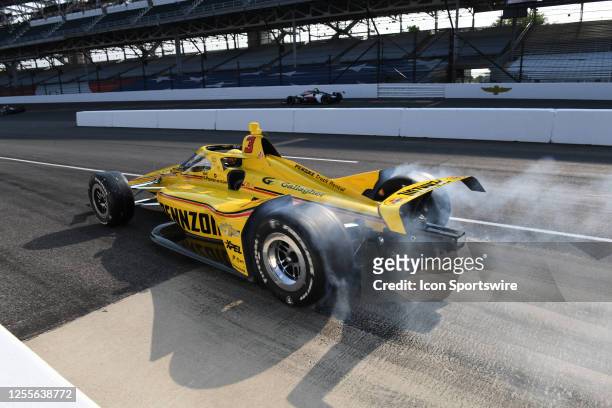Scott McLaughlin Dallara IR12 Chevrolet does a burn out on new tires during the first day of practice for the 107th Indianapolis 500, Wednesday, May...