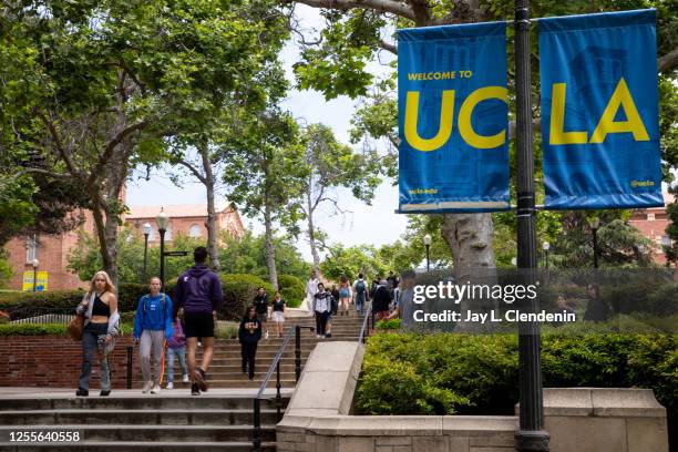 Los Angeles, CA Signage and people along Bruin Walk East, on the UCLA Campus in Los Angeles, CA, Wednesday, May 17, 2023.