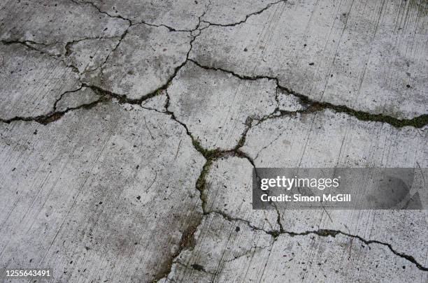 cracked concrete pavement - broken concrete stock pictures, royalty-free photos & images