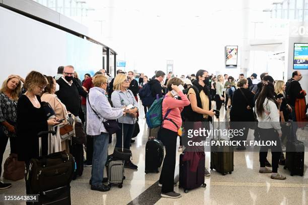 Passengers wait in line to board a KLM Royal Dutch Airlines flight during the SkyTeam Alliance 2023 Sustainable Flight Challenge at Los Angeles...