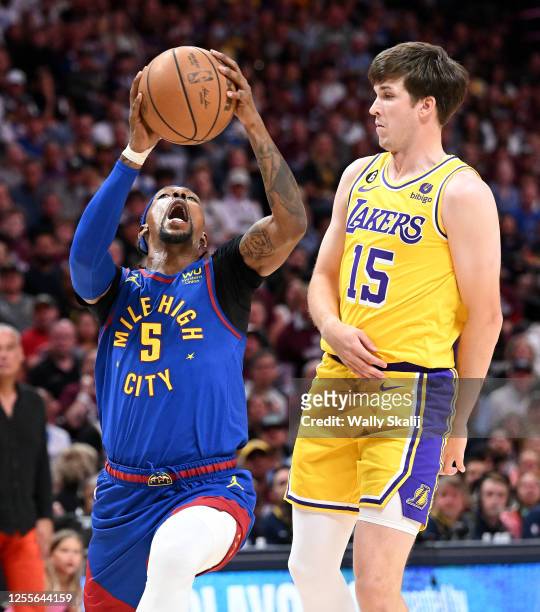Denver, Colorado May 16, 2023-Nuggets Kentavious Caldwell-Pope drives past Lakers Austin Reaves in Game 1 of the Western Conference Finals in Denver...