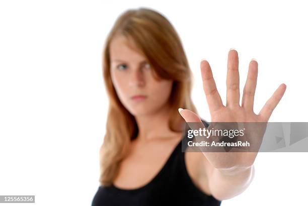 a woman with her hand up symbolizing no - angry redhead stock pictures, royalty-free photos & images