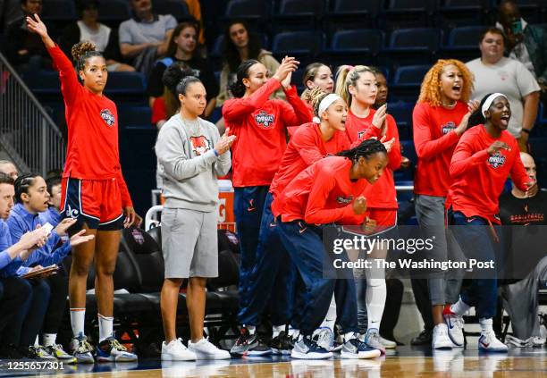 Washington Mystics guard Kristi Toliver and the bench cheer on the starters during action against the Atlanta Dream at the Entertainment and Sports...