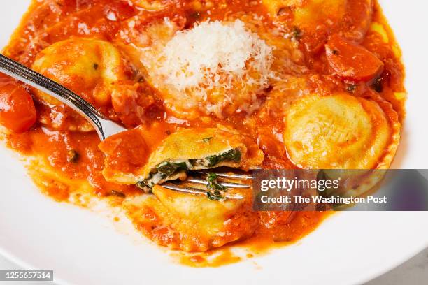 Ravioli di spinaci - Stuffed with Spinach and Ricotta, in Tomato Cream Sauce at Il Piatto photographed in Washington, DC on May 7, 2023. .